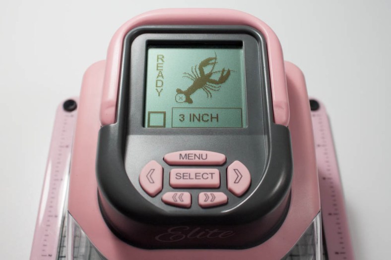 I created a 4-inch-high die-cut of a lobster using my Making Memories Slice Elite, "Under the Sea" design card and red textured cardstock.