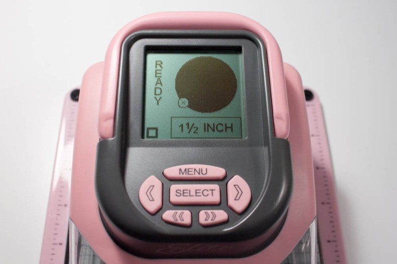 I created a 1 1/2-inch circle out of white cardstock using my Slice and "Basic Elements" design card.