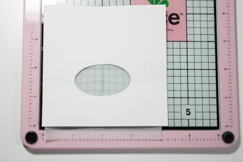 I used the scrap cardstock to repeat the cut on a 4-inch-square piece of vellum.